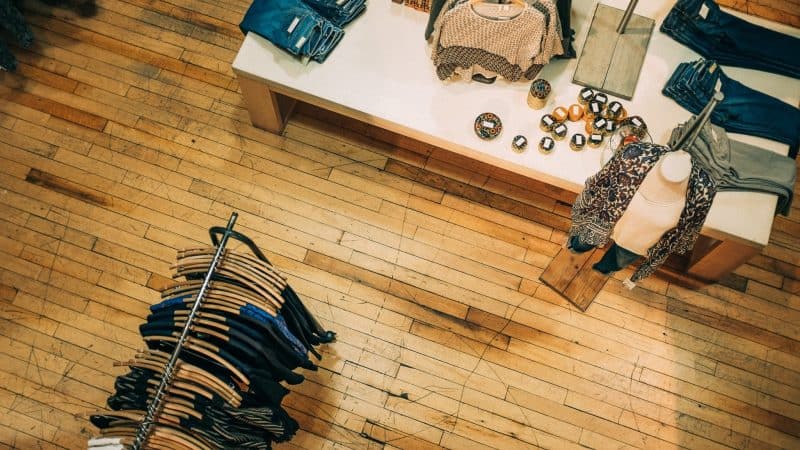 Rustic wooden flooring in a retail clothing store